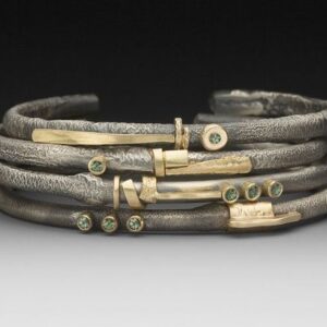 Mixed metal rings of sterling silver and gold.